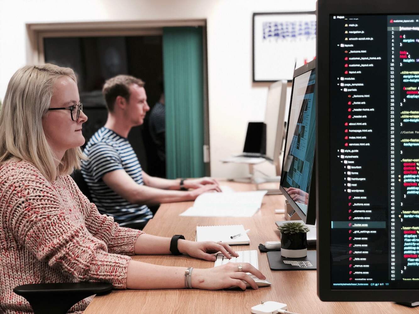 mmtm developers at a desk working on a project